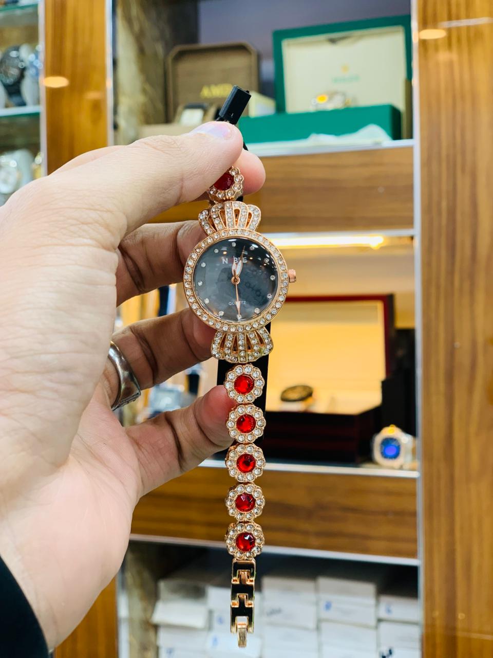 Royal Gold Bracelet Watch with Red Crystal Accents