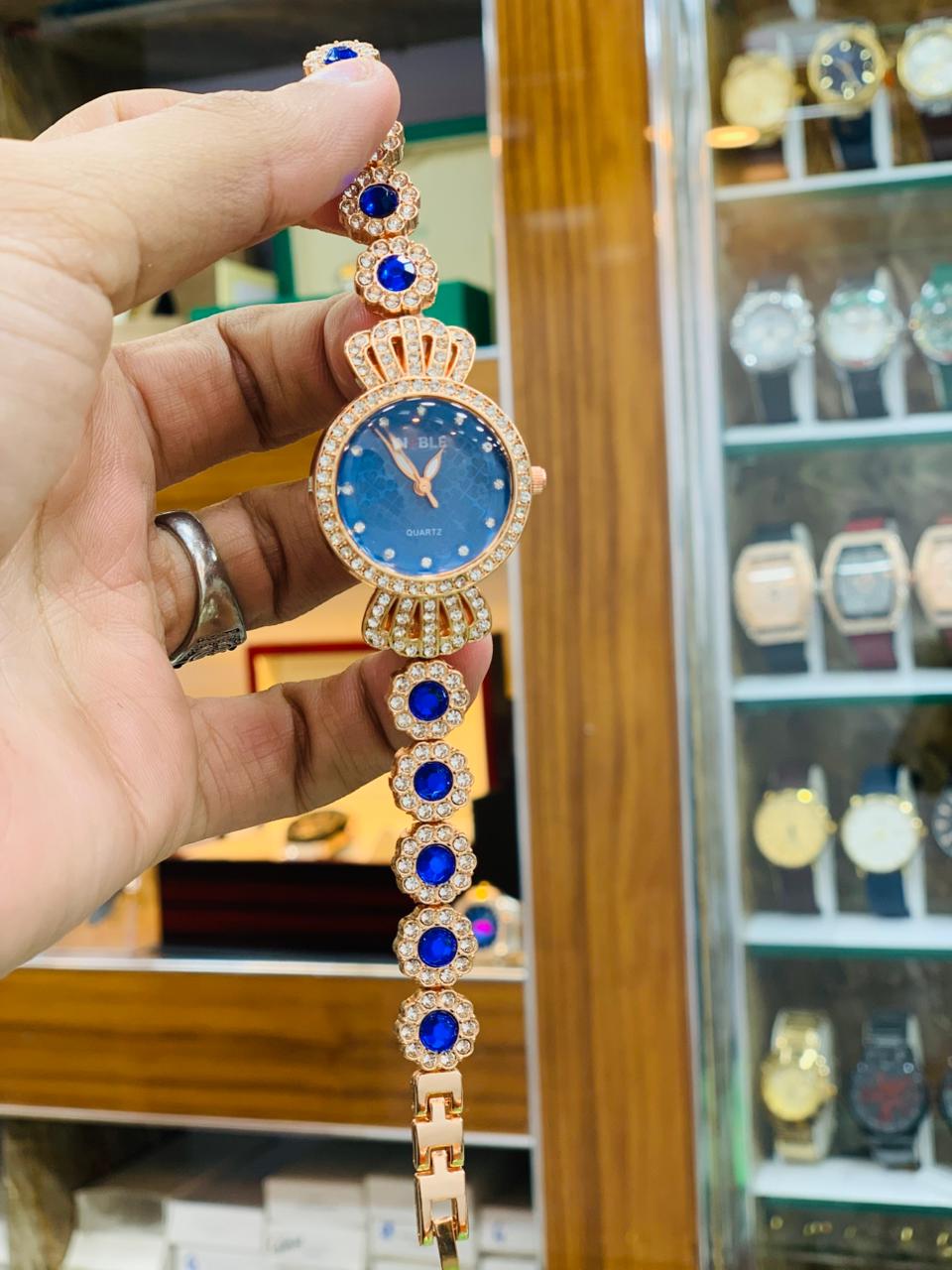 Royal Gold Bracelet Watch with Red Crystal Accents