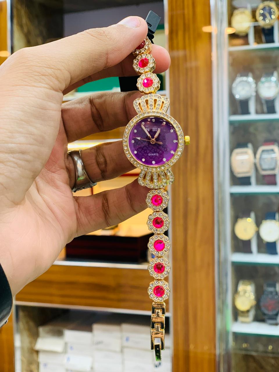 Royal Gold Bracelet Watch with Red Crystal Accents