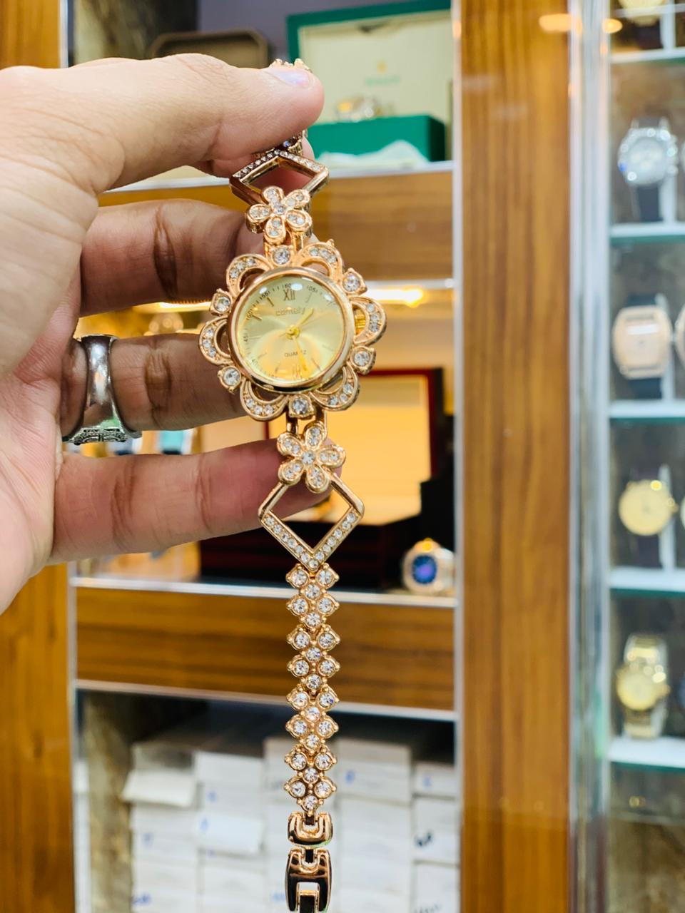 Royal Gold Bracelet Watch with Red Crystal Accents