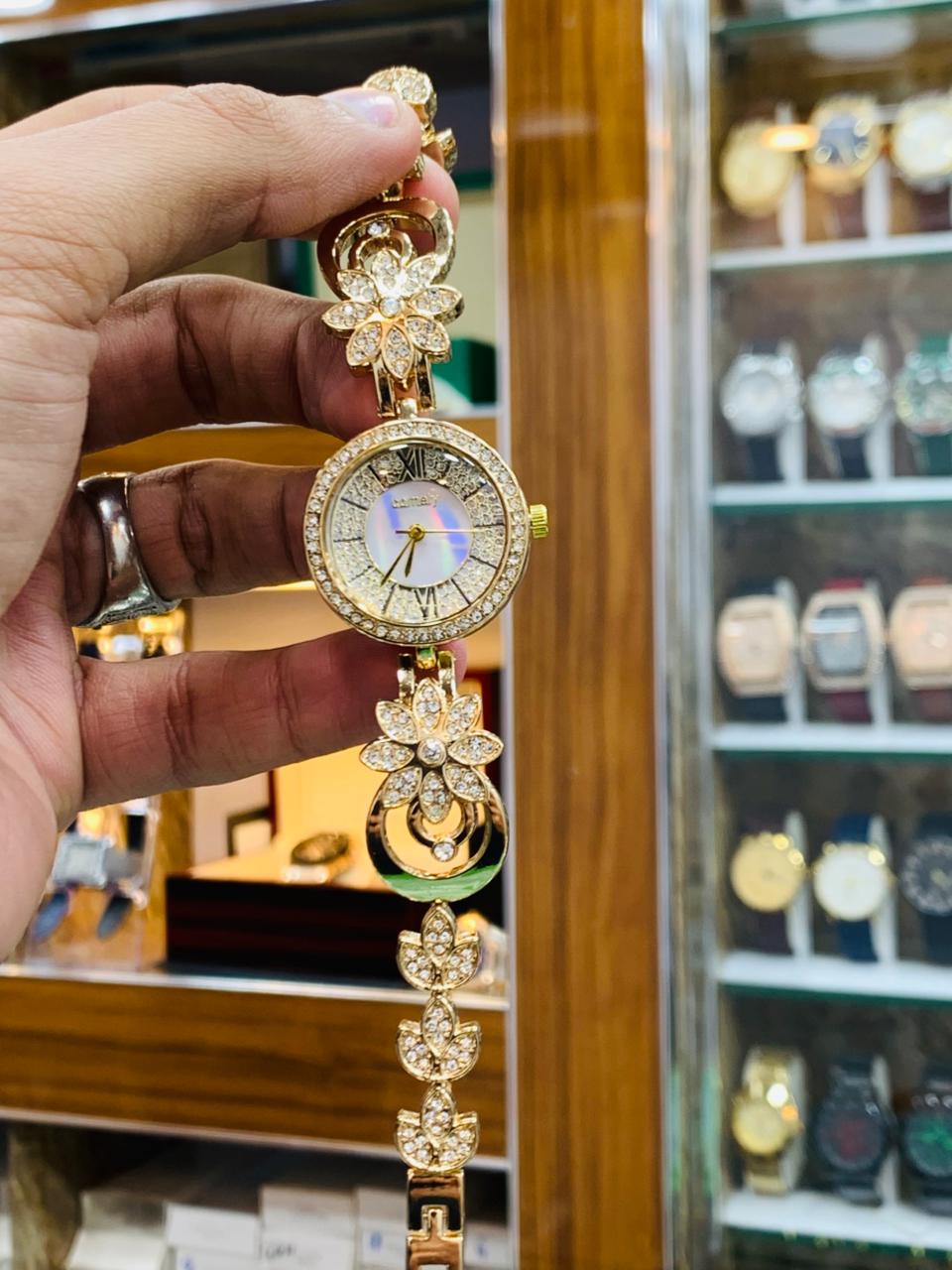 Royal Gold Bracelet Watch with Red Crystal Accents